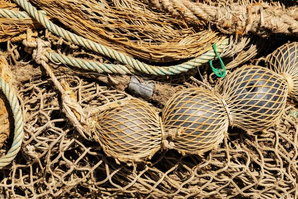 Old fishing nets with ropes and floats - Full fram — Stock Photo, Image