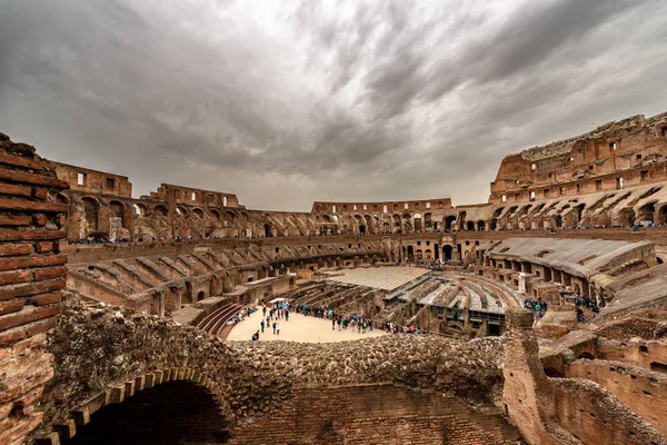 Interior of Rome Colosseum with many tourists — Stock Photo, Image