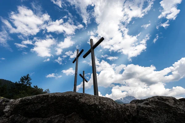 Three Christian crosses on blue sky with clouds — Stock Photo, Image