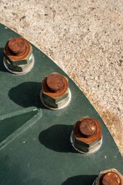 Close-up of rusty bolts with nuts and screws clipart