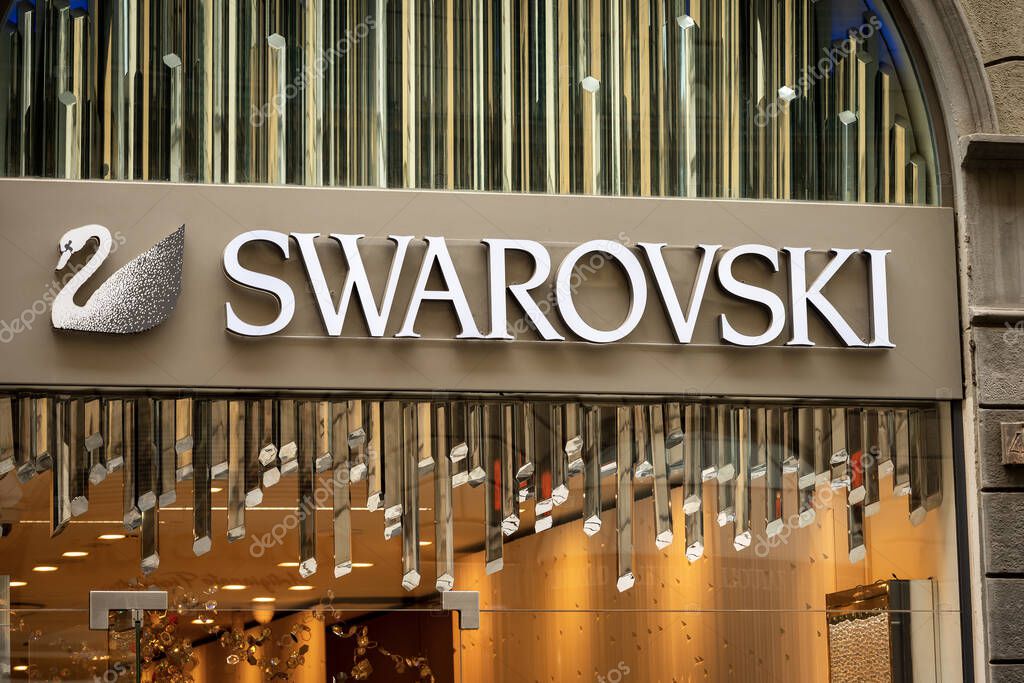 FLORENCE, ITALY - AUG 3, 2020: Closeup of the Swarovski corporate logo above the shop window of a luxury boutique in Florence downtown. Tuscany, Italy, Europe