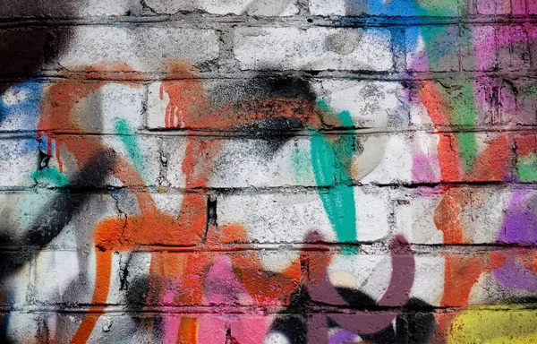 Street art. Abstract background. Chaotically painted brick walls with multi-colored paint — Stock Photo, Image