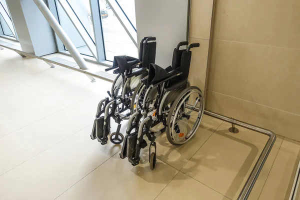 wheelchair in the airport building. Caring for people with disabilities