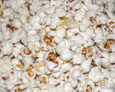 Patlamış mısır closeup dokusal arka plan. Sinema için yemek