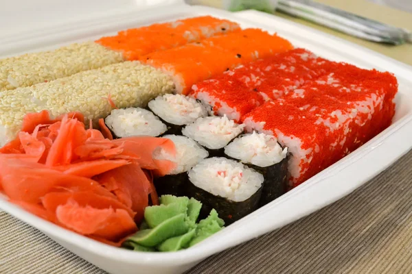 Rolls, sushi set in plastic packaging, close up