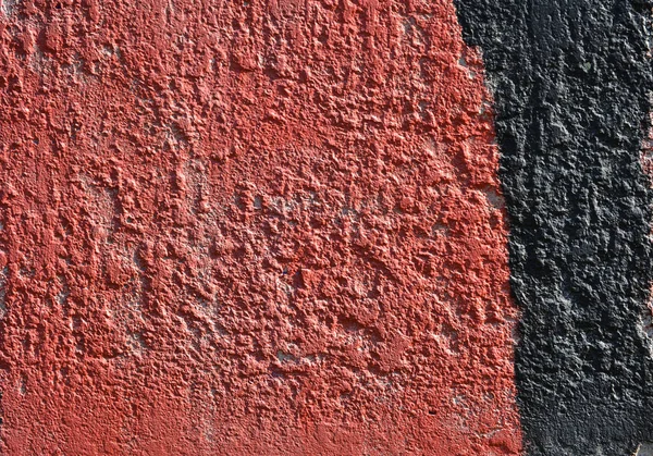 Κόκκινη και μαύρη μπογιά στον τοίχο. Μέρος του γκράφιτι. Grunge. Φόντο υφής — Φωτογραφία Αρχείου