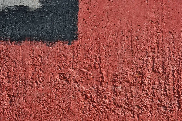 墙上有红色和黑色的油漆。涂鸦的一部分。垃圾。纹理背景 — 图库照片