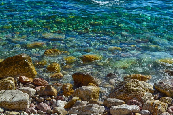 The sea view. Calm sea and large stones. Transparent water of the Adriatic Sea. Montenegro — Stock Photo, Image