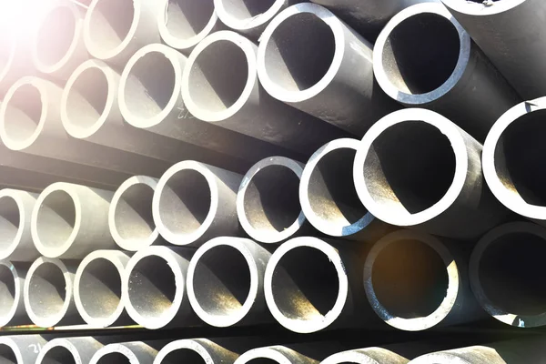 Plastic pipes in stock of finished products stacked in packs — Stock Photo, Image