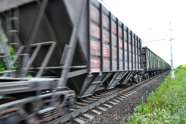 Freight train, railway wagons with motion blur effect. Transportation, railroad. — Stock Photo, Image