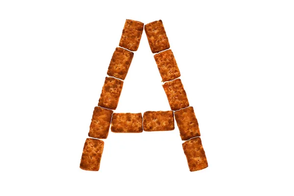 Алфавит состоит из печенья на белом изолированном фоне. буква А — стоковое фото