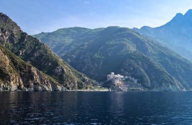 Orthodox Greek monastery on Mount Athos. View from sea. Dionysiou. clipart