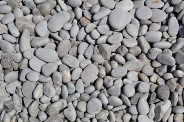 Güneşli plajda çakıl arka plan.