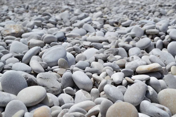 Fundo abstrato com seixos - pedras marinhas redondas — Fotografia de Stock