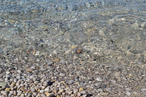 Abstrakt strand bakgrund textur med grus, sand och havsvatten i Bodrum Turkiet — Stockfoto