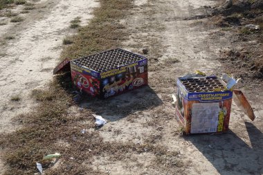 Russia Moscow region September 13, 2019: Left firework batteries spoil the cobblestone pavement after the traditional new years celebration clipart