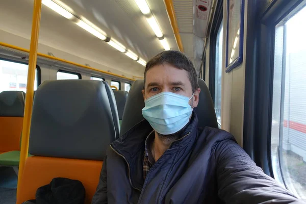 man wearing face mask; concept of dust air pollution, virus infection, coronavirus pandemic outbreak, sickness, new norm social distancing, physical distance, public new normal personal distancing