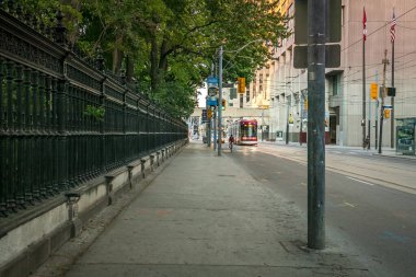 Empty street without people. Quarantine city Toronto buildings, skyscraper, downtown. Evening time, sunset