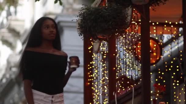 Young Woman Walks Street Drinks Cofee Cup Smiles Background City — Stock Video