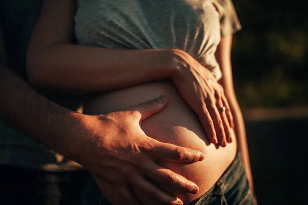 Man Embraces Belly His Pregnant Wife Walk Closeup — Stock Photo, Image