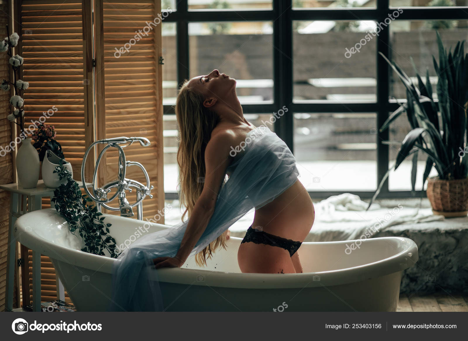 Pregnant wife taking a bath