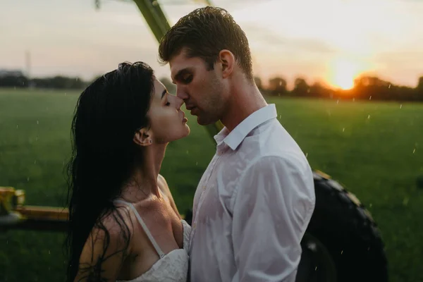 Couple Love Stands Embraces Lawn Water Drops Agricultural Sprayer Sunset — Stock Photo, Image