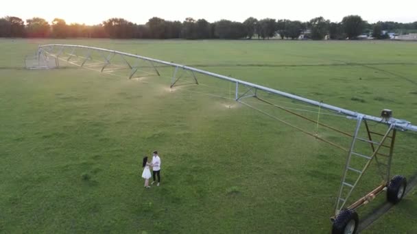 Couple Love Embraces Water Sprays Agricultural Sprayer Drone Shooting — Stock Video