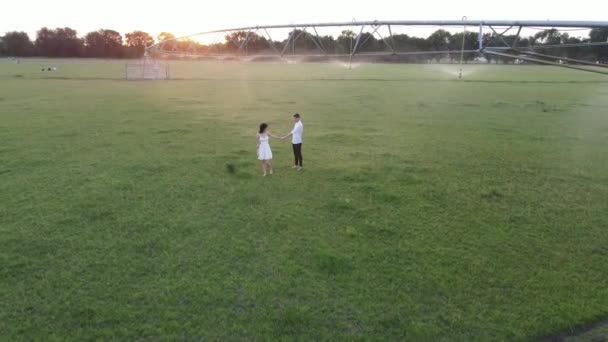 Couple Love Walks Water Sprays Agricultural Sprayer Sunset Drone Shooting — Stock Video