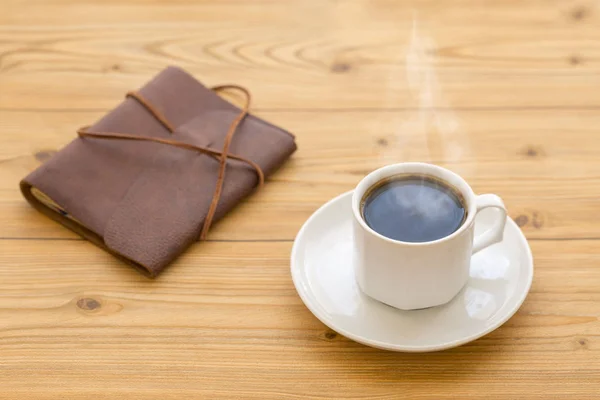 Hot Coffee Steam Leather Journal Brown Wooden Table — Stock Photo, Image