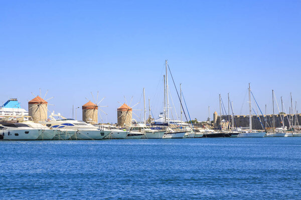 Windmills in mandraki port in Rhodes, Dodecanese, Greece