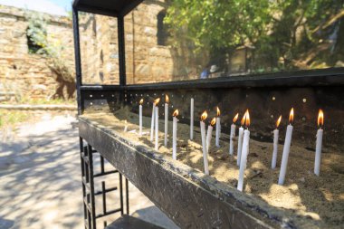 Candles near house of virgin Mary, believed last residence of Mary in Ephesus, Turkey clipart