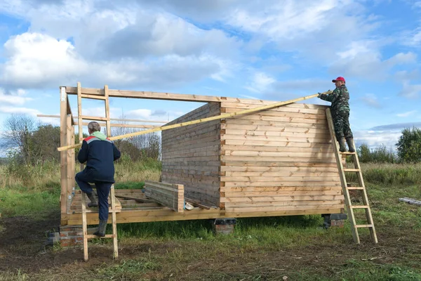 Construction of a wooden house in a rural area