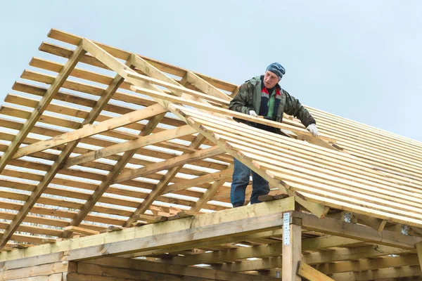 Construction of a wooden house in a rural area