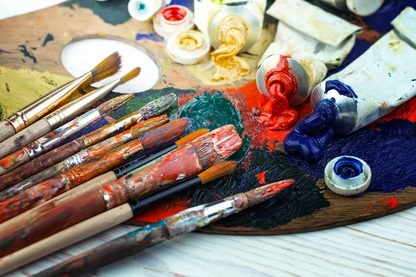 Paint brushes and paints for drawing.