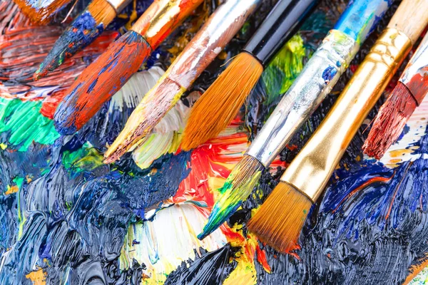 Paint brushes and paints for drawing.