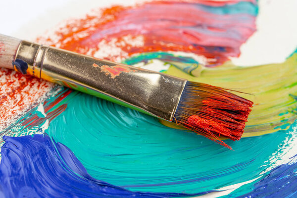 Paint brushes and paints for drawing.