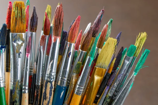 Paint brushes and paints for drawing.