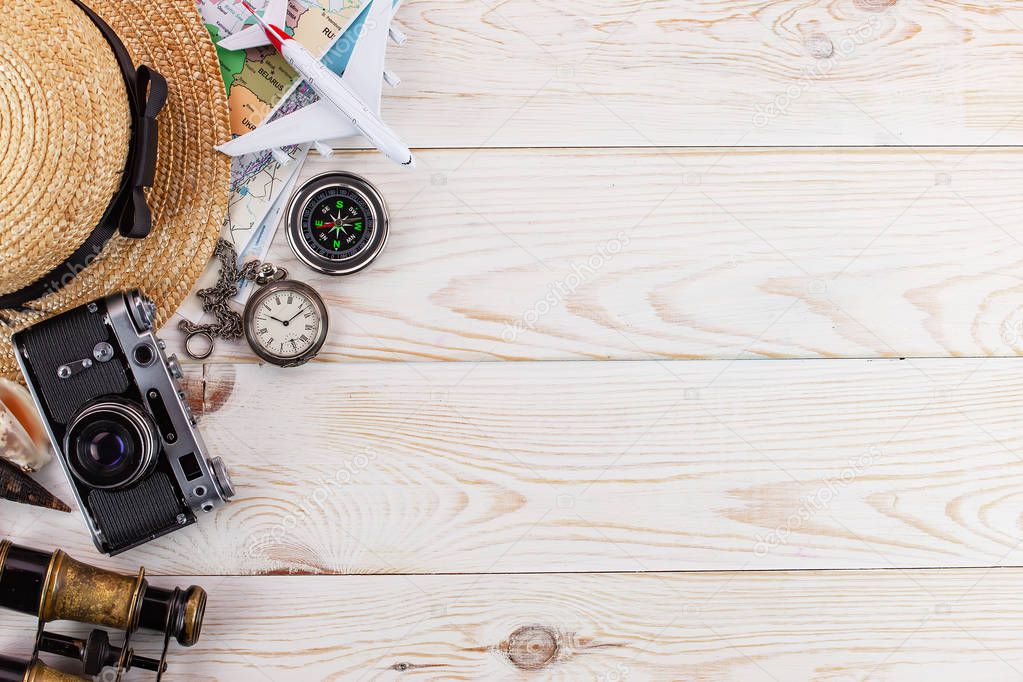 items and accessories for the traveler on the old background on the table