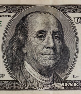 Portrait of benjamin franklin on the hundred dollar bill closeup clipart