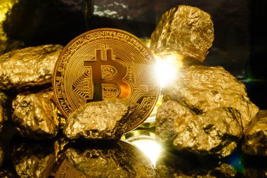 Bitcoin and mound of gold nuggets, crypto currency concept clipart