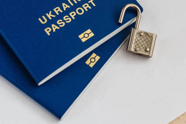 Два Сині Паспорти Білому Тлі Відкритим Замком — стокове фото