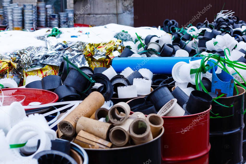 cans with trash on a city street