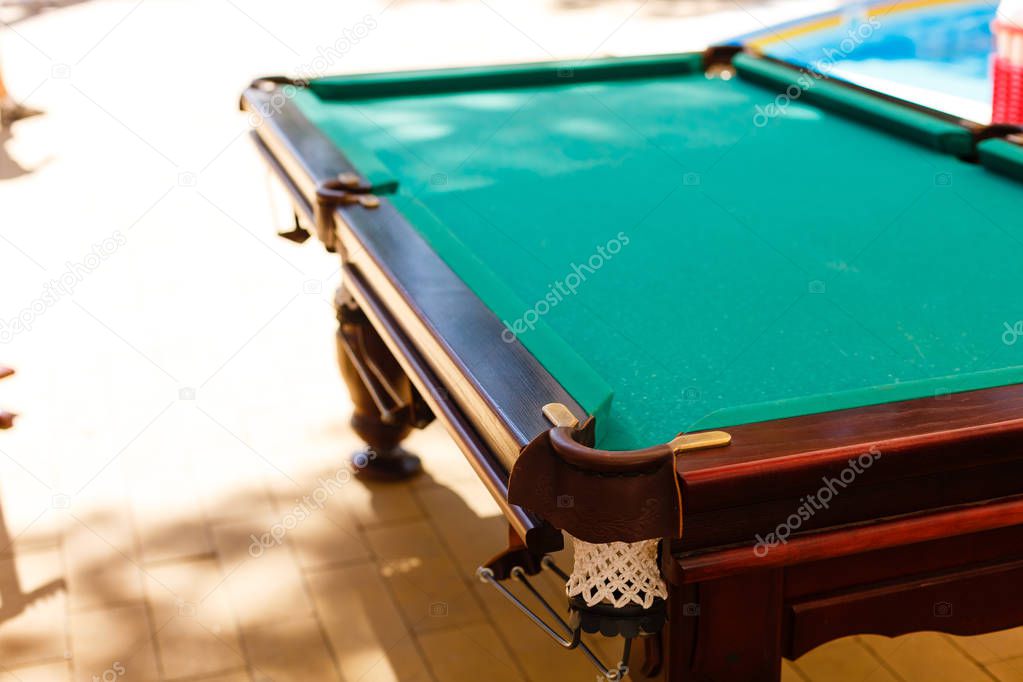 Snooker, Billiard or Pool game on green surface table, International sport, the hole on the green table.