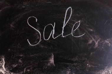 Blackboard with sale written on it 