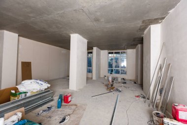 Dismantling of apartment interior before upgrade. Material for repairs in an apartment is under construction, remodeling, rebuilding and renovation clipart