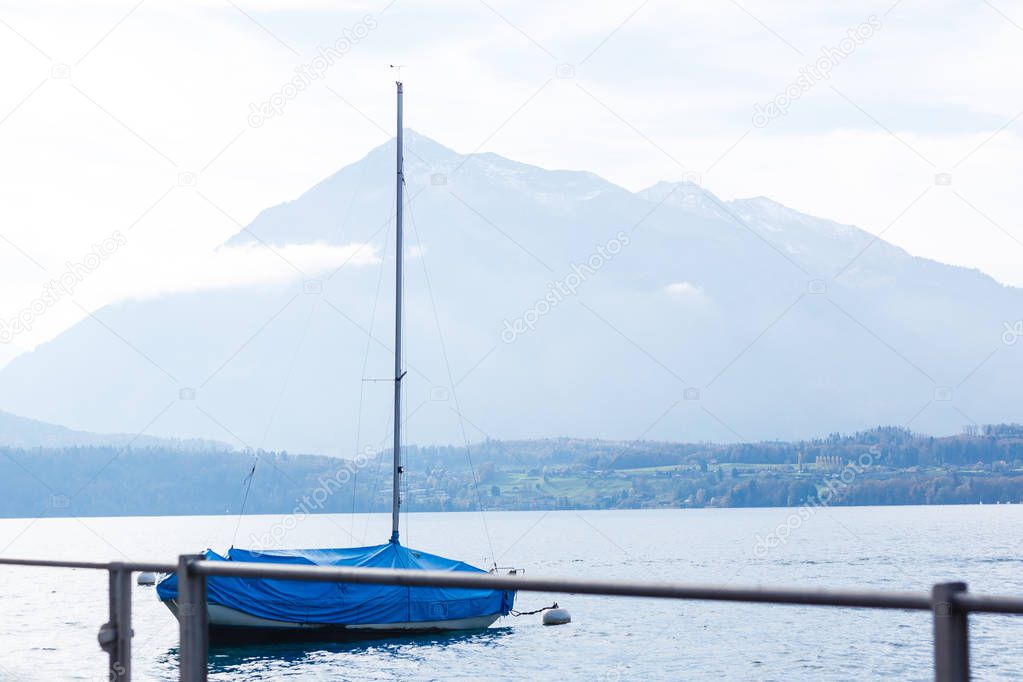 boat in the lake against the backdrop of the mountain