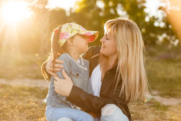 Cute Young Daughter Hugging Sitting Her Mother Park — Stock Photo, Image