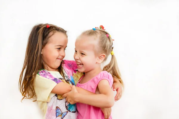 Portrait Little Girl Embracing Sister Isolated White Background — Stock Photo, Image