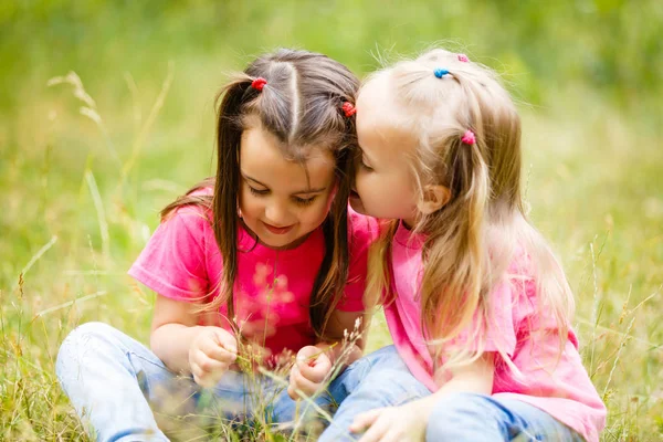 Two Little Girls Playing Sitting Green Park Grass Royalty Free Stock Photos