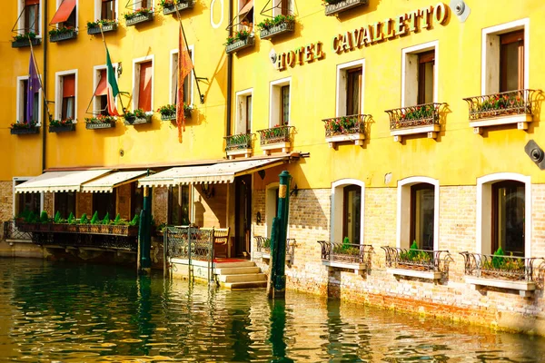 Water on the street near the sea between houses in Venice